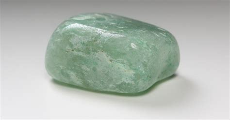 What is jadeite glass, and why does it shimmer like a forgotten dream?